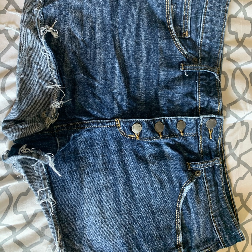 Lightly destroyed low rise denim shorts